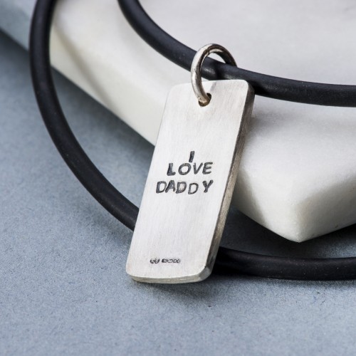 Men’s silver pendant on rubber with rip detail and personalsiation
