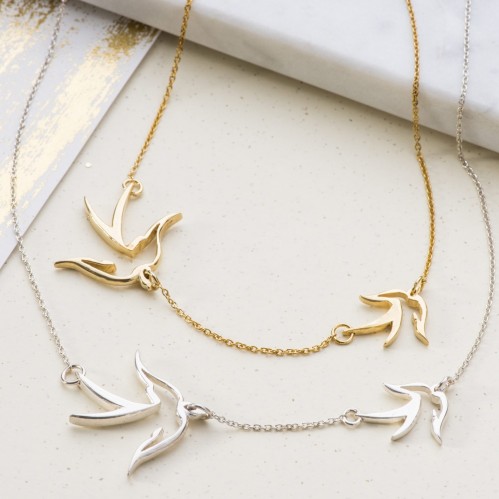 Double bird necklace symbolising mother and child