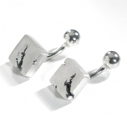 These rugged square cufflinks have back cracks running through them making them unique in design