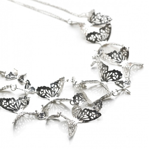 Delicate yet striking this Large Multi Butterfly necklace features handmade textured butterflies linked together to make the most stunning statement necklace